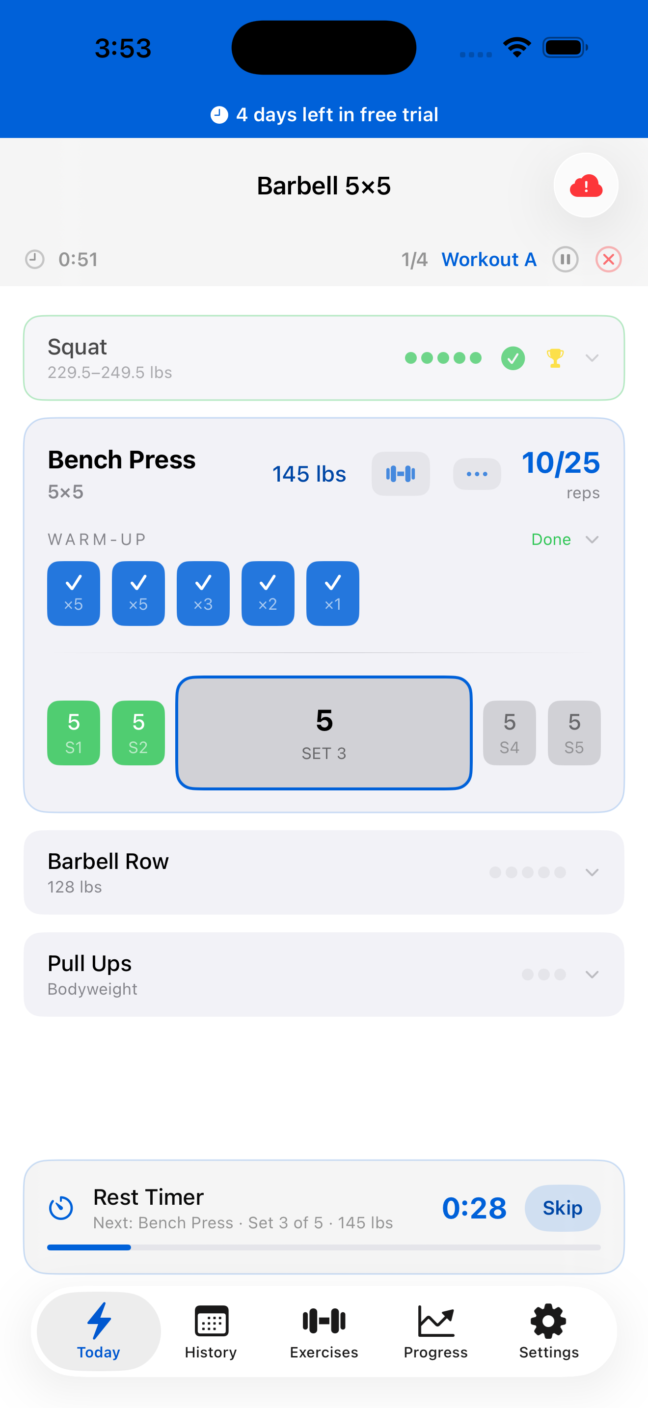 Active workout view showing set tracking, warm-up sets, and rest timer